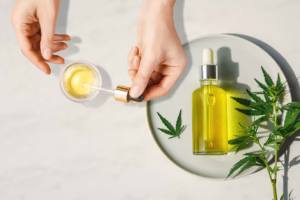Cannabis oil and dropper with a few leaves